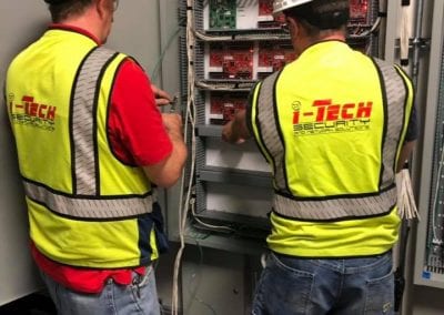 Installers working on access control panels